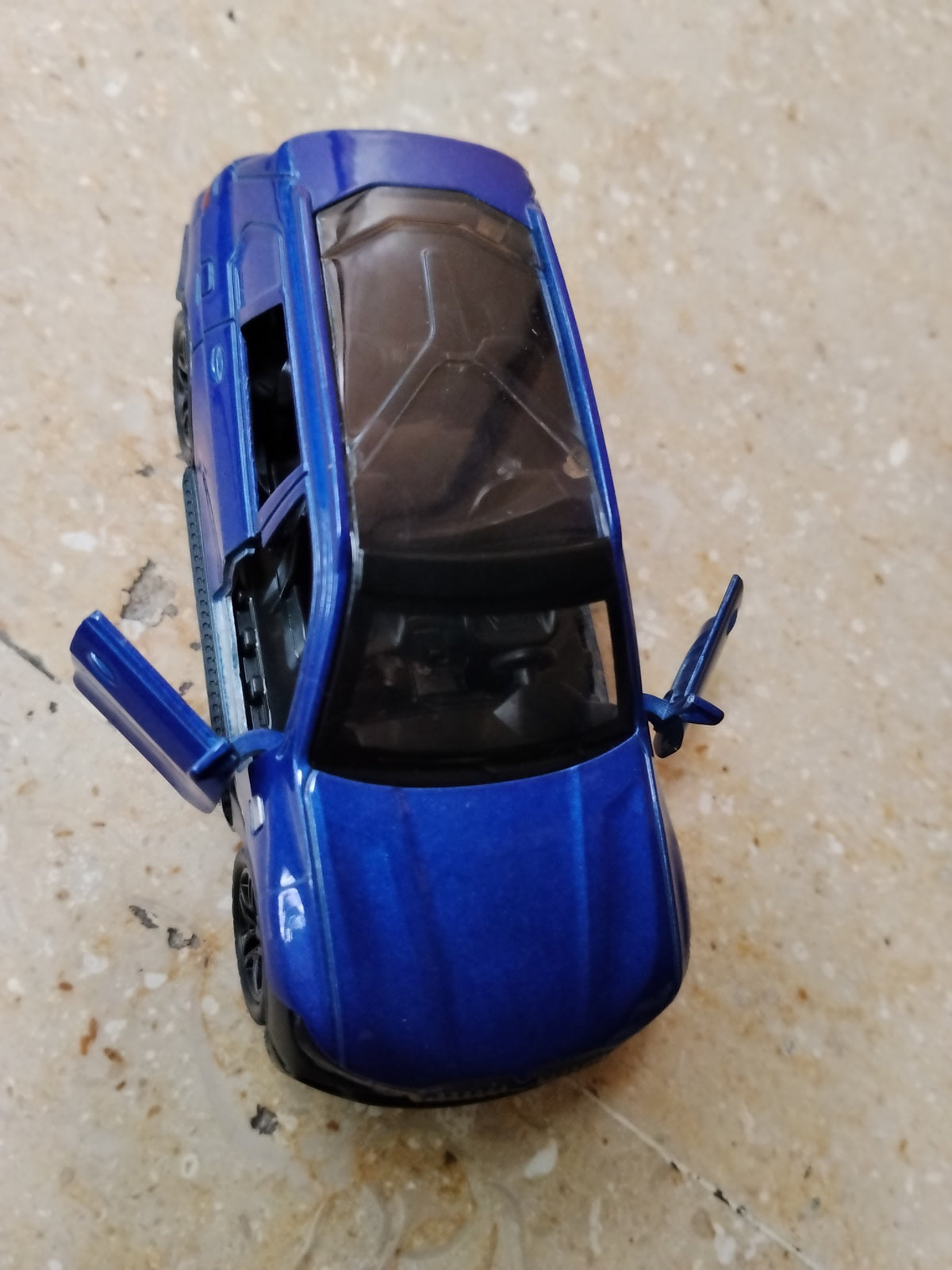 Blue BMW die-cast metal toy car with opening front doors