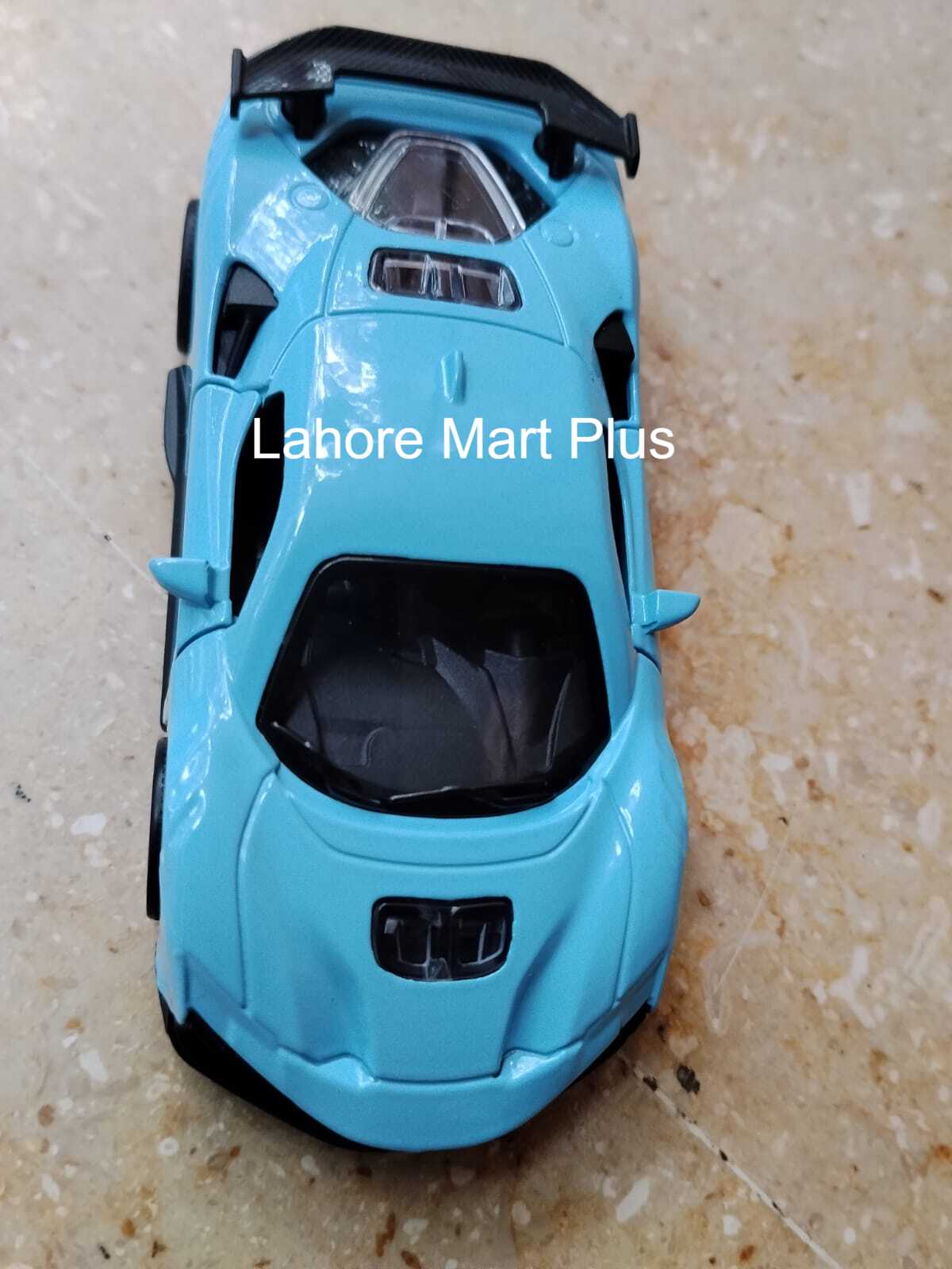 Blue metal toy sports car top view