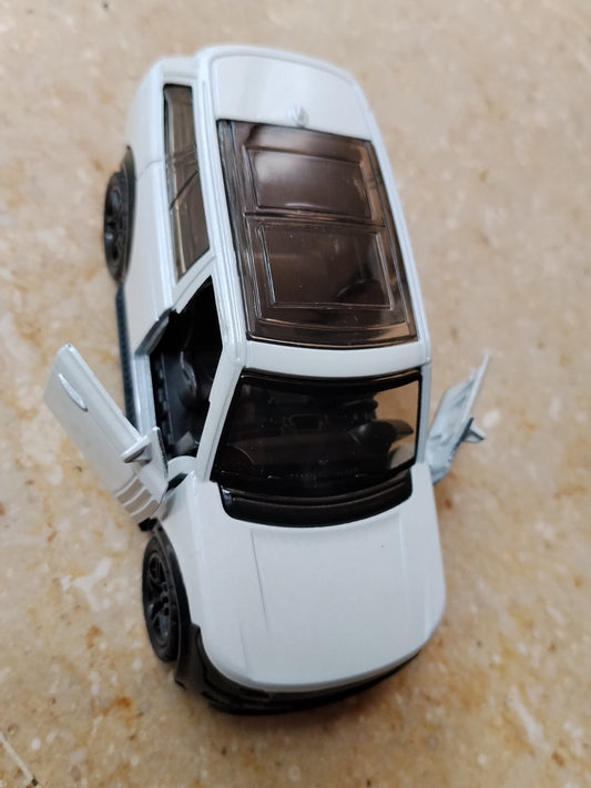 White die-cast metal toy sports car with opening doors