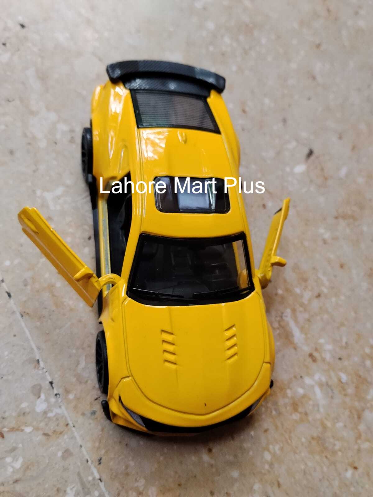 Yellow Lamborghini Aventador LP700-4 with opening front doors